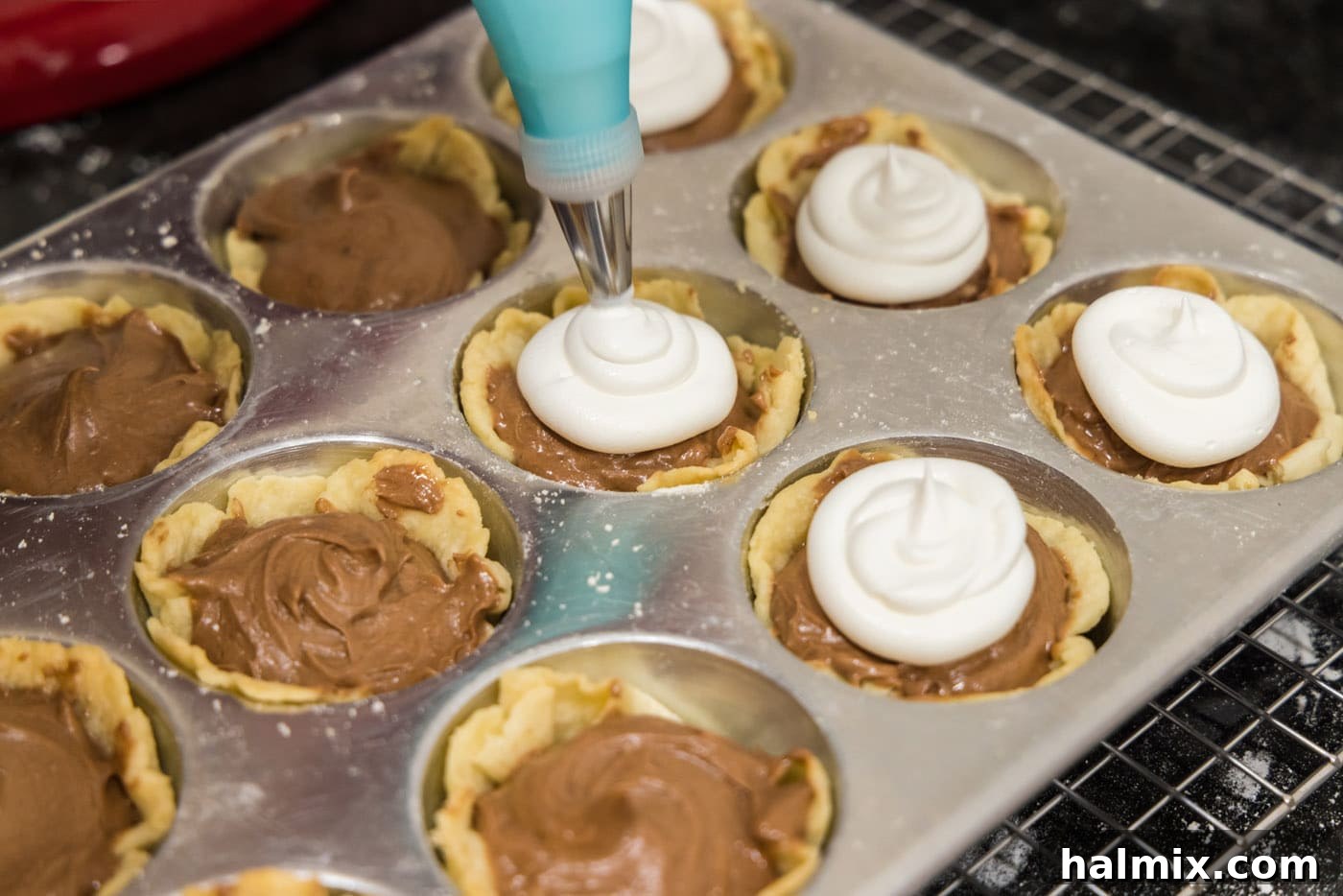 Decadent Mini French Silk Treats 27 Piping whipped cream onto mini French Silk Pies