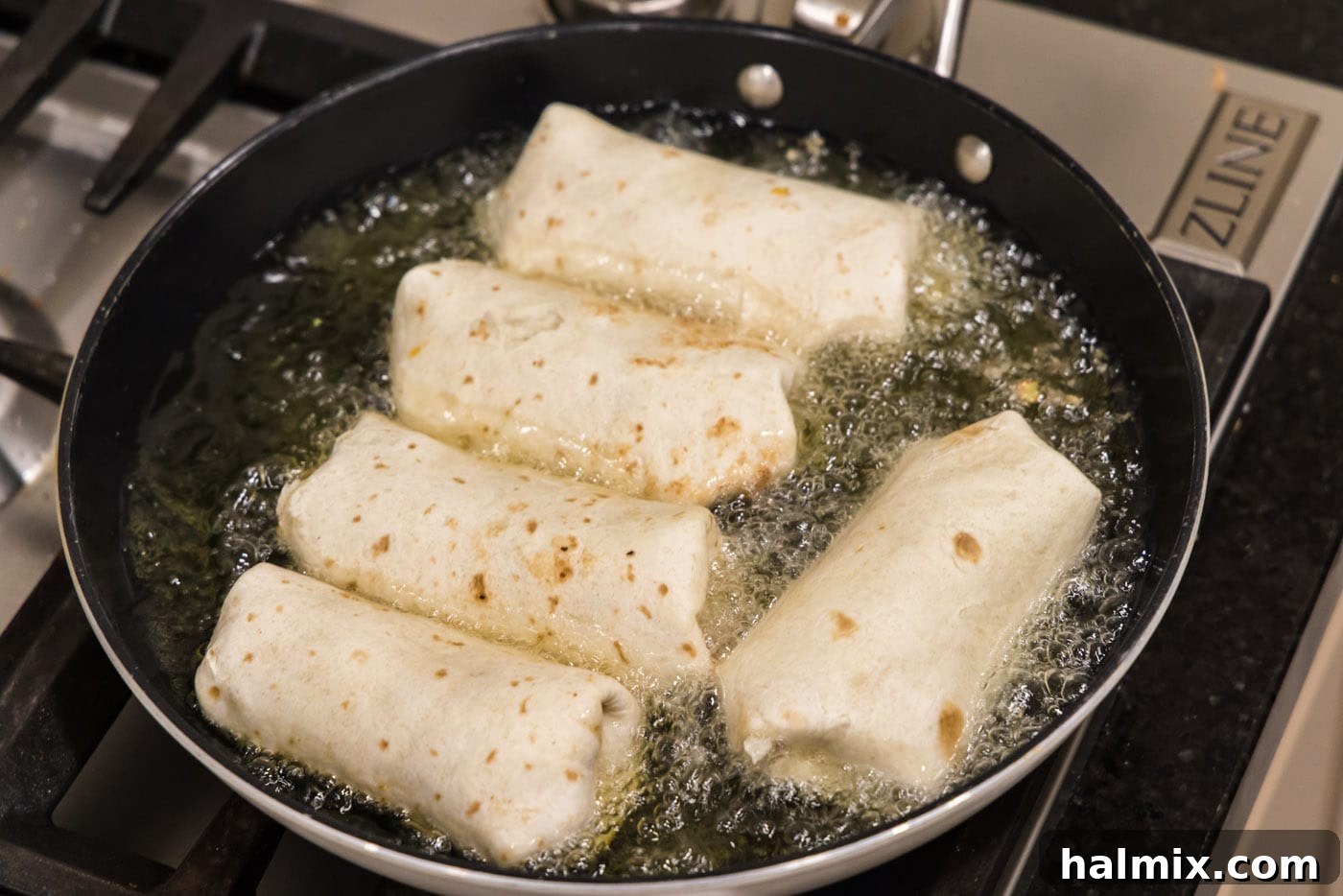 Deep-Fried Mexican Delights 18 deep frying chimichangas in a skillet, achieving a crispy golden exterior