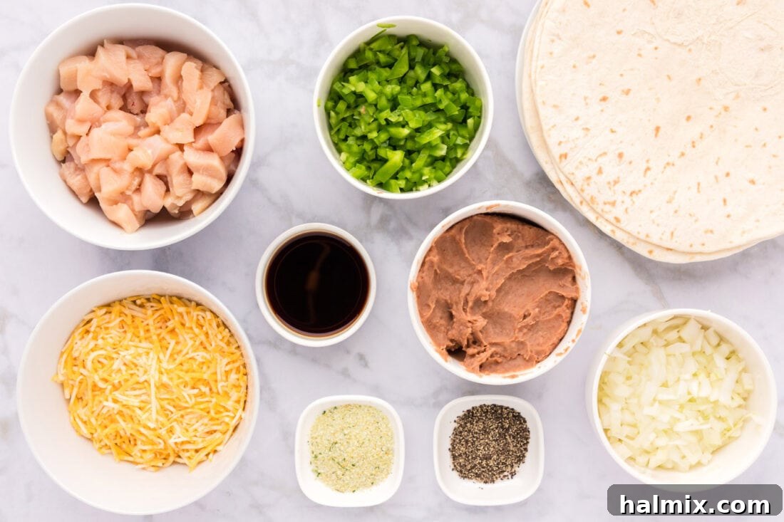 Deep-Fried Mexican Delights 4 A flat lay of all the fresh ingredients needed for making chimichangas, including chicken, vegetables, tortillas, and cheese