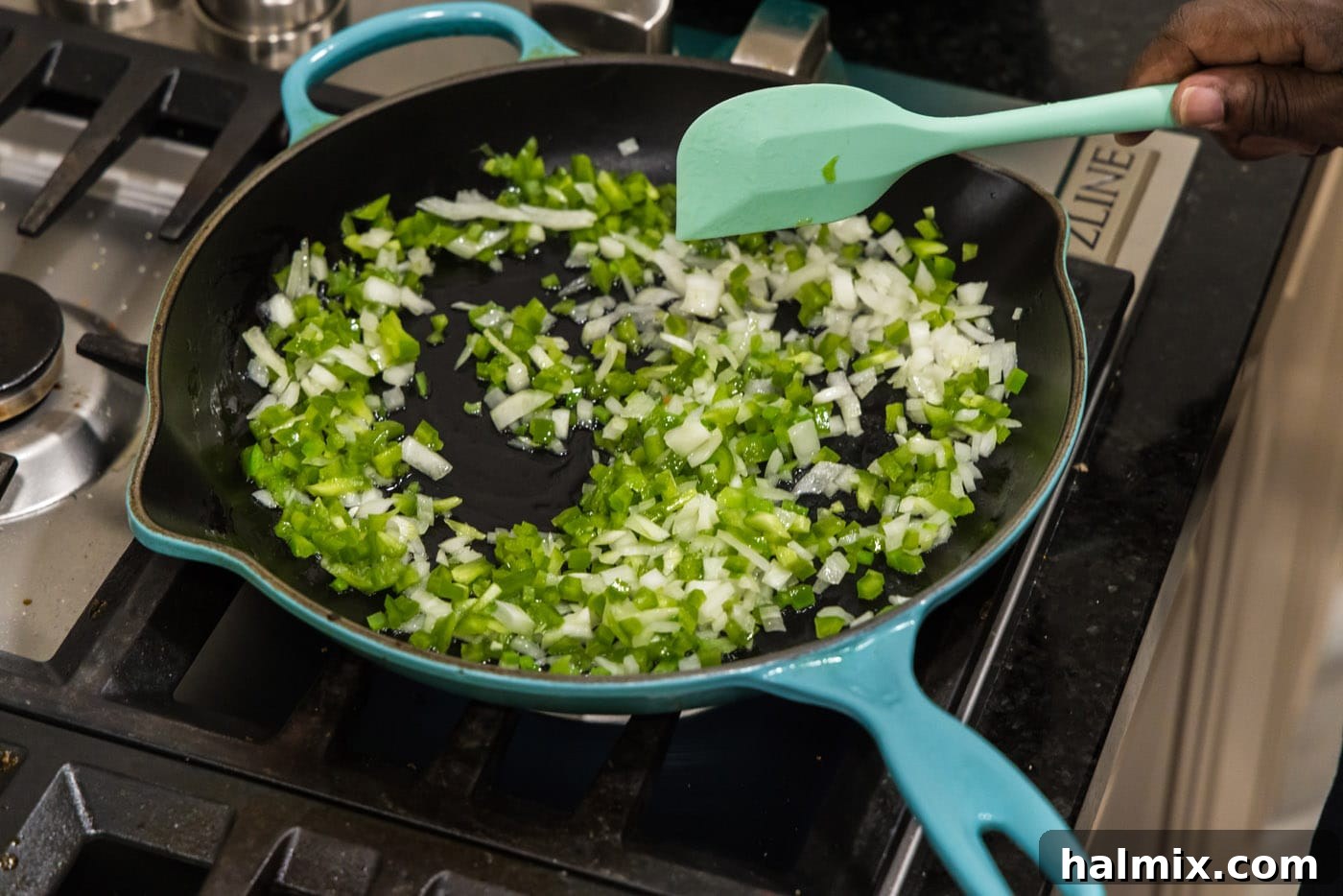 Deep-Fried Mexican Delights 8 mixing green pepper and onion in a skillet, starting the sauté process for the filling