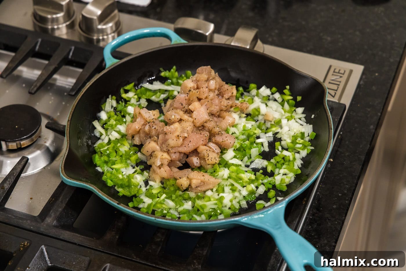 Deep-Fried Mexican Delights 9 adding cubed chicken to skillet with sautéed veggies, ready to cook the protein