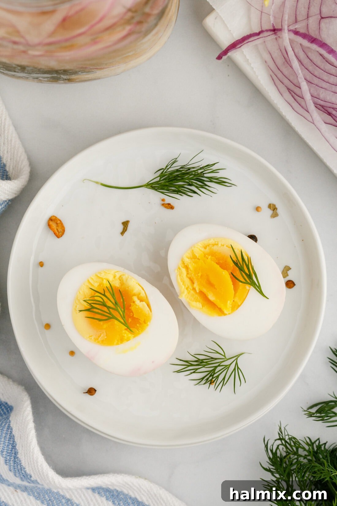 A Pickled Egg cut in half on a plate