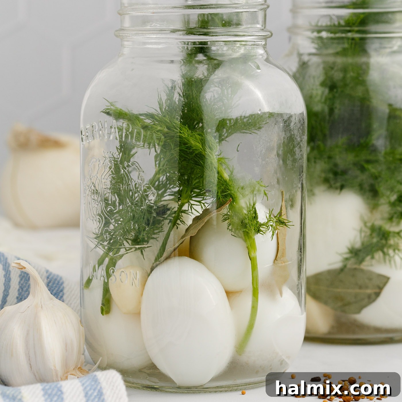 hard boiled eggs and fresh herbs in a mason jar