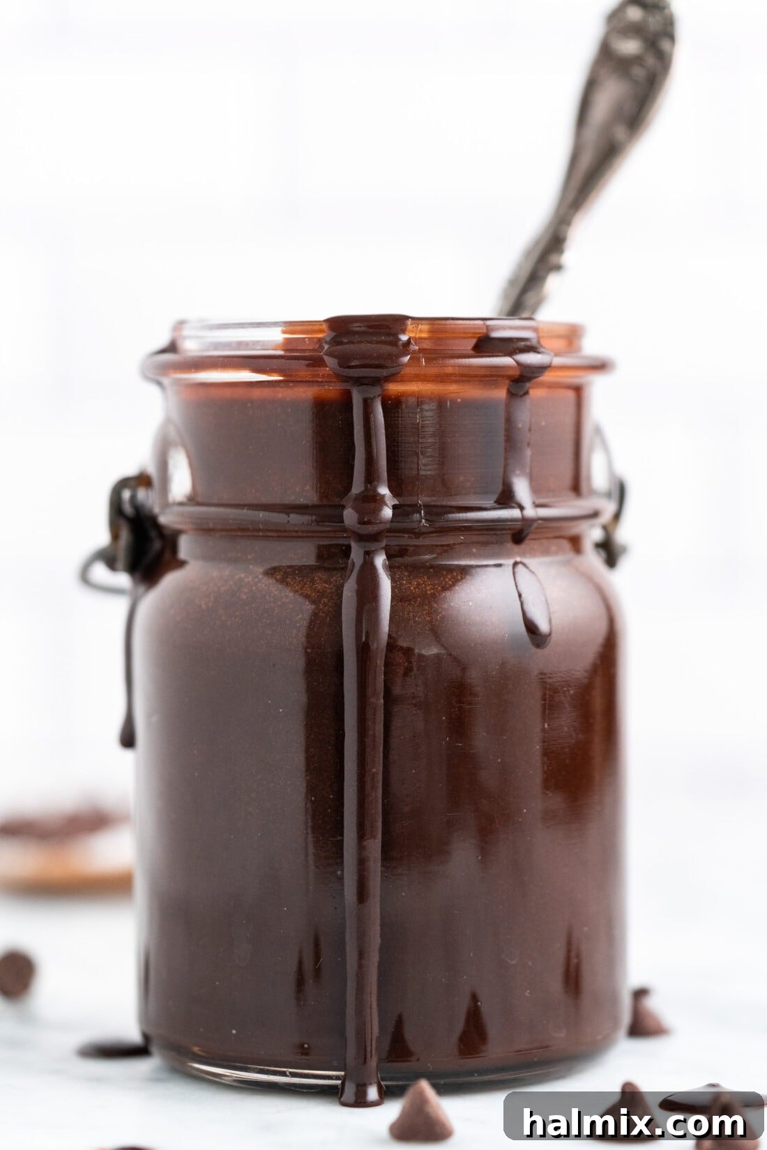 Warm Chocolate Indulgence 3 Hot Fudge in a jar with a spoon