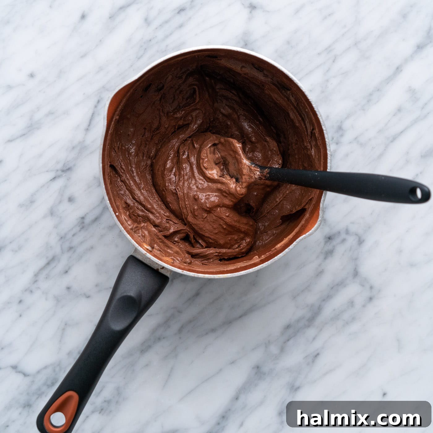 Warm Chocolate Indulgence 6 chocolate mixture stirred in a saucepan