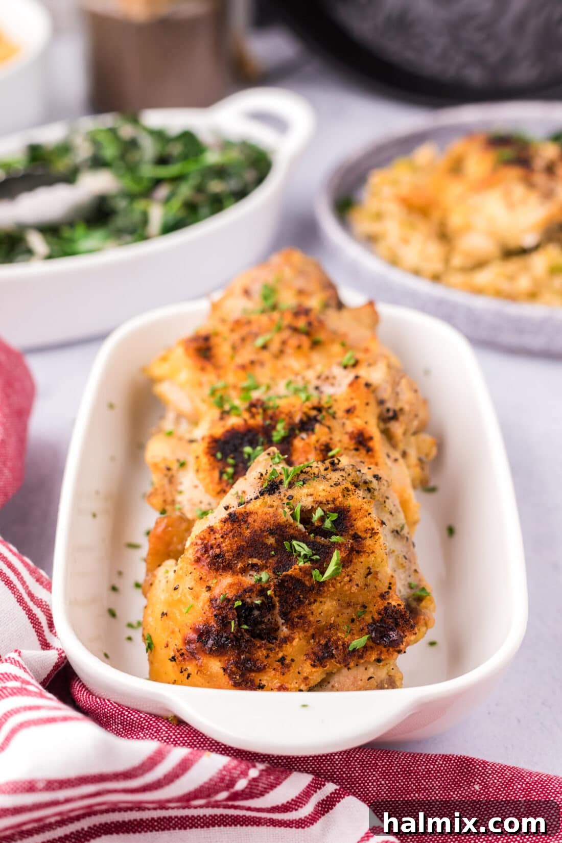 Serving dish filled with perfectly cooked Instant Pot Chicken Thighs, ready for family dinner.