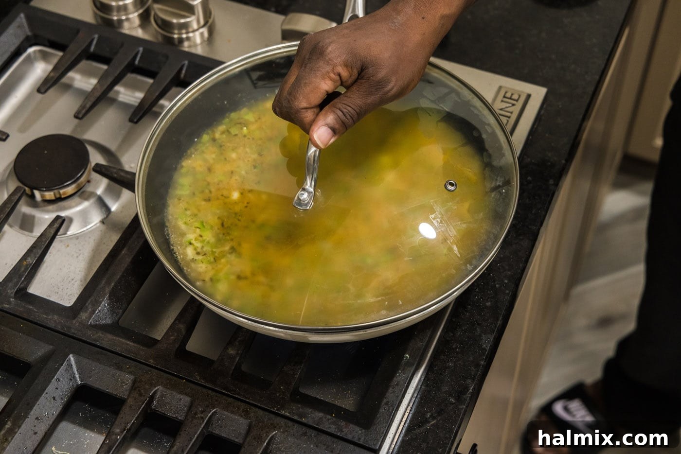 Spicy Southern Comfort Rice 10 A tight-fitting lid placed on the skillet, crucial for trapping steam and allowing the Cajun rice to cook evenly and absorb all liquid.