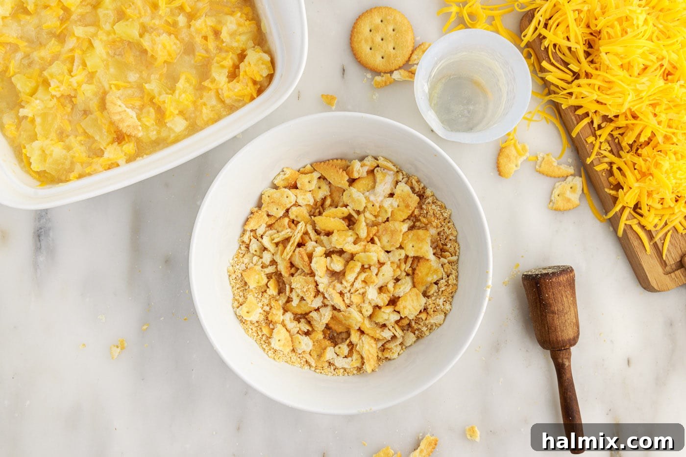 crushed ritz crackers with melted butter in a bowl