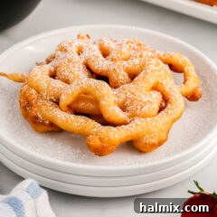 Golden Carnival Whirl 15 Funnel Cake topped with powdered sugar, a perfect golden swirl