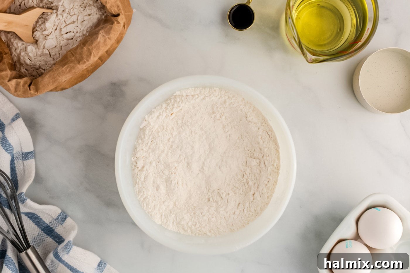 Golden Carnival Whirl 5 All-purpose flour, granulated sugar, baking powder, and salt whisked in a bowl