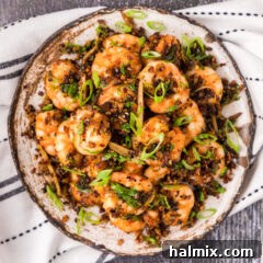 Overhead photo of a plate of Salt and Pepper Shrimp, beautifully presented for serving.