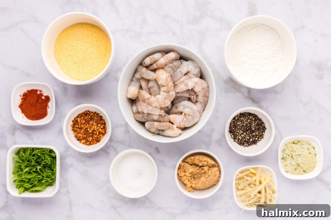 All the fresh ingredients laid out on a wooden board, ready for preparing Salt and Pepper Shrimp.