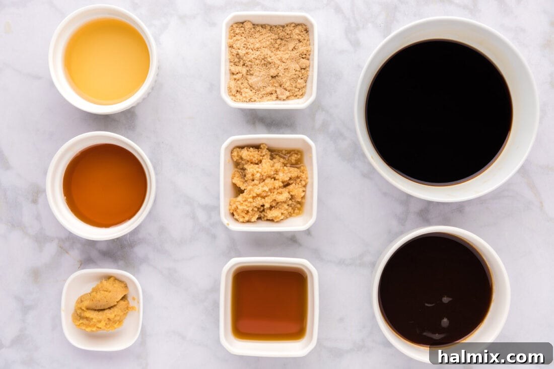 Various fresh ingredients for homemade teriyaki sauce, including soy sauce, honey, ginger, and garlic, laid out on a wooden surface.