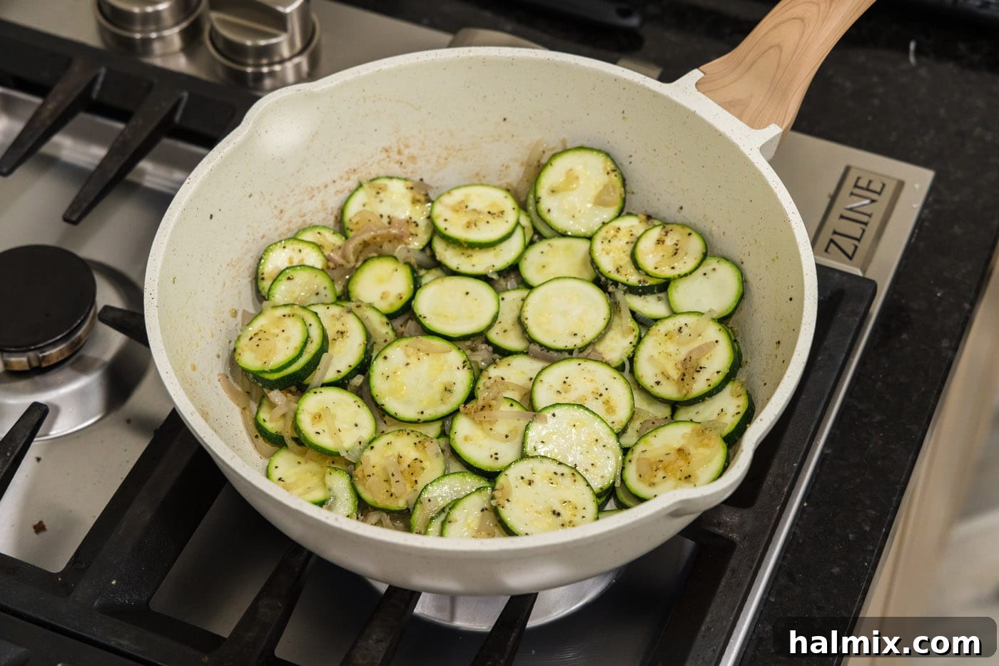 sliced zucchini with seasonings in a skillet