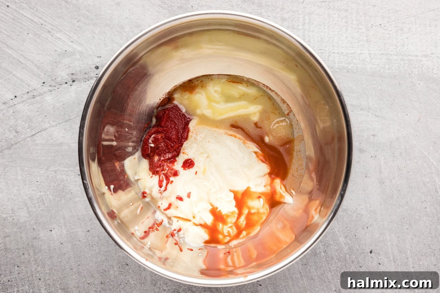 All ingredients for yum yum sauce in a mixing bowl before whisking