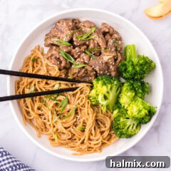 Beef Teriyaki on a plate served with teriyaki noodles and broccoli