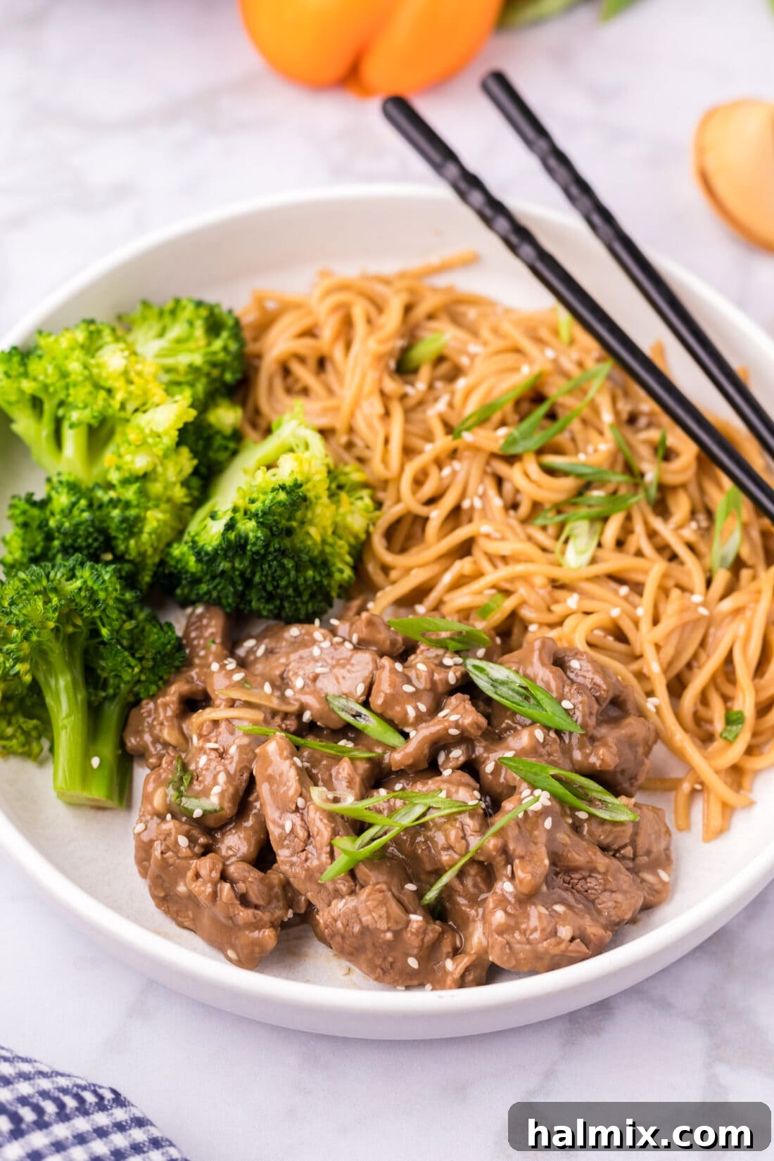 Beef Teriyaki served with broccoli and teriyaki noodles