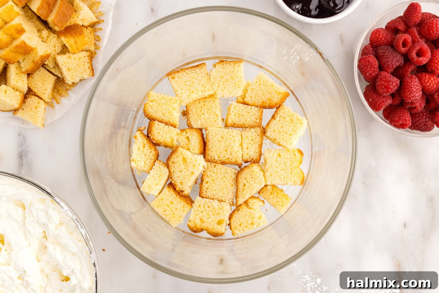pound cake cubes on the bottom of a trifle bowl