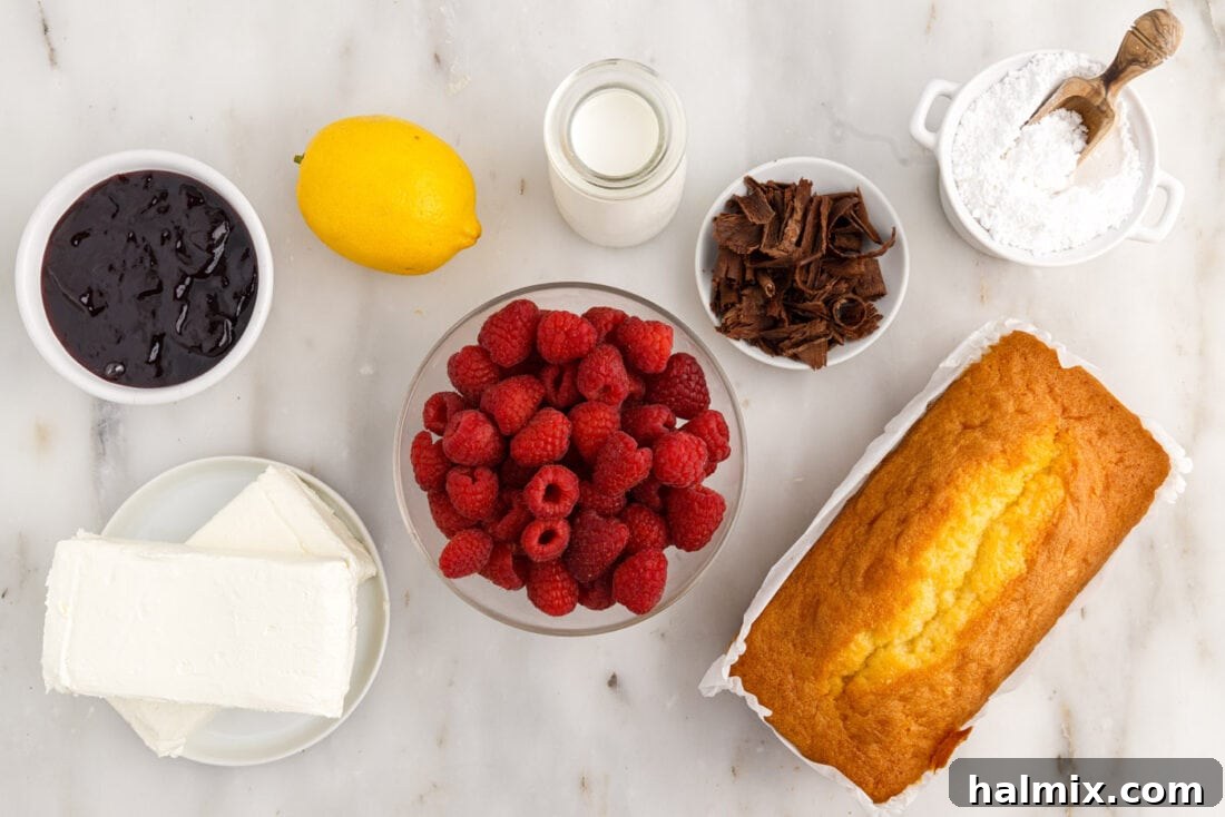 Ingredients for Raspberry Trifle arranged on a white surface.