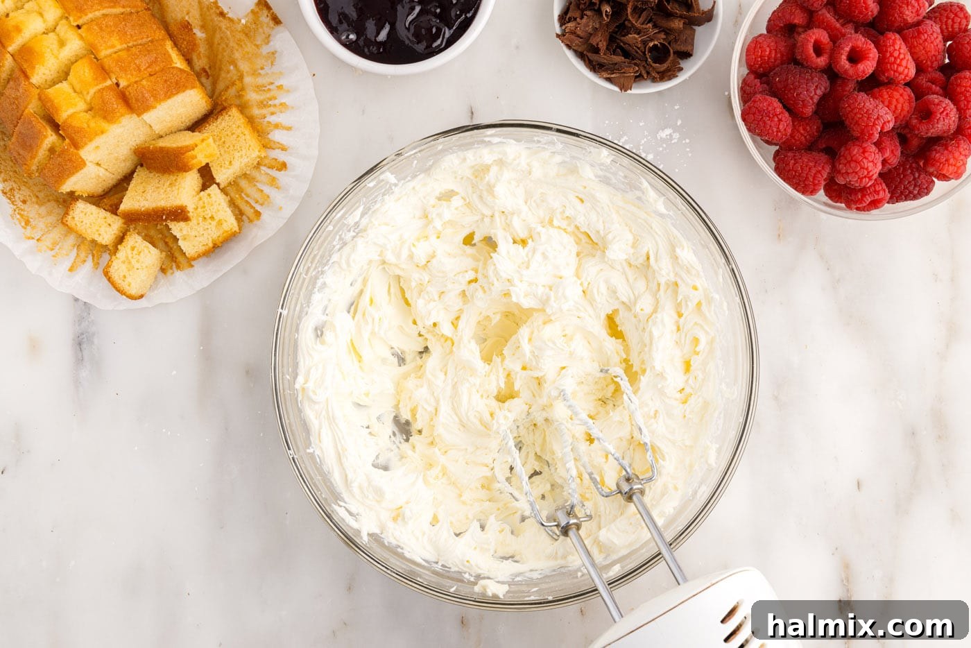 cream cheese mixture in a bowl with a mixer