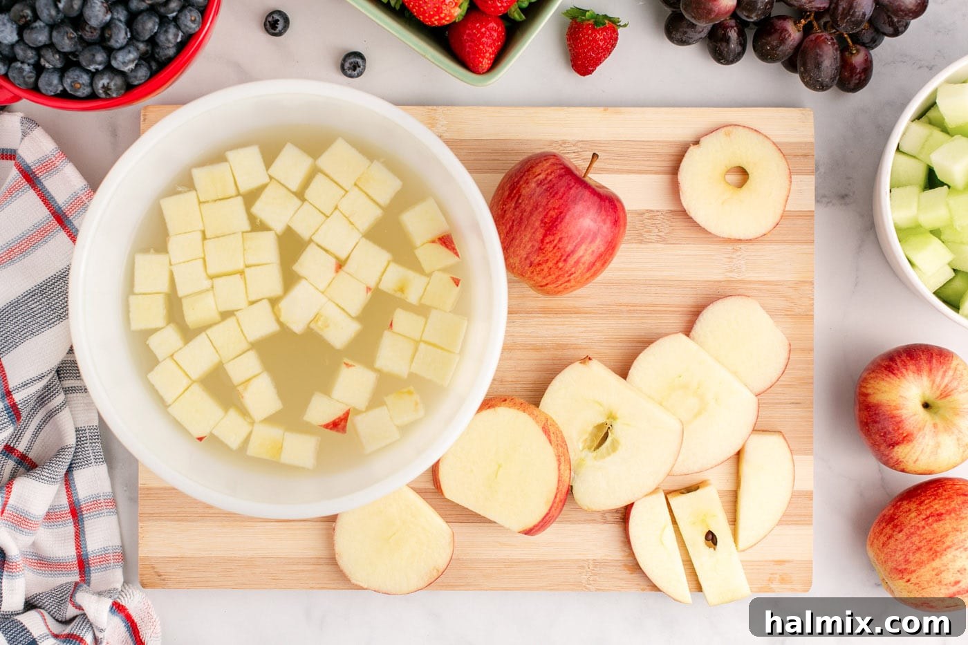 chopped apples soaking in lemon juice water mixture