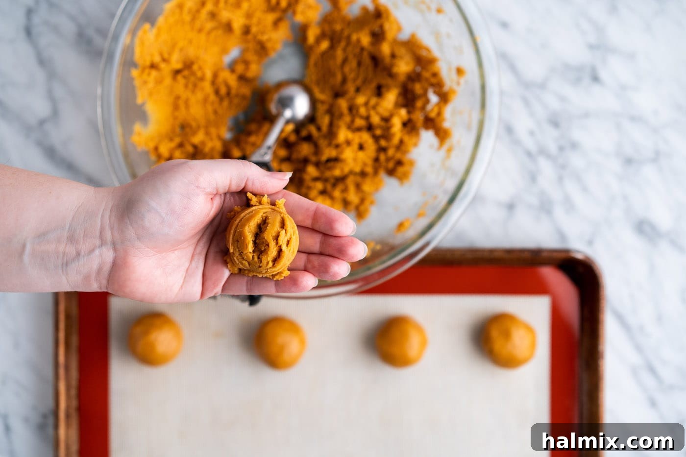 rolling cookie dough into a ball