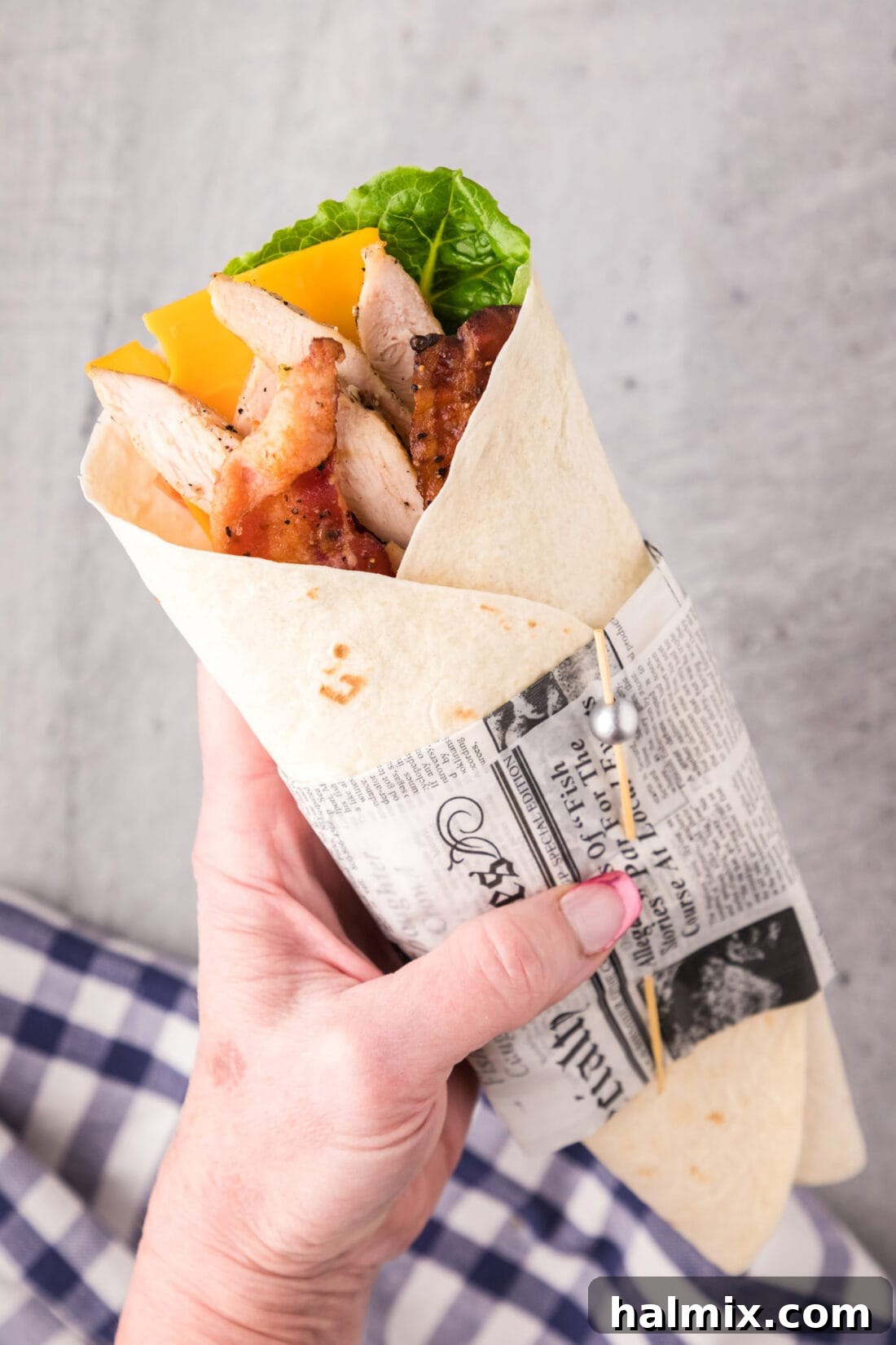 Hand holding a Chicken Bacon Ranch Wrap