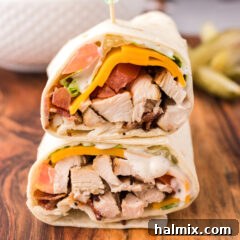 Close up photo of a Chicken Bacon Ranch Wrap cut in half and stacked on top of eachother