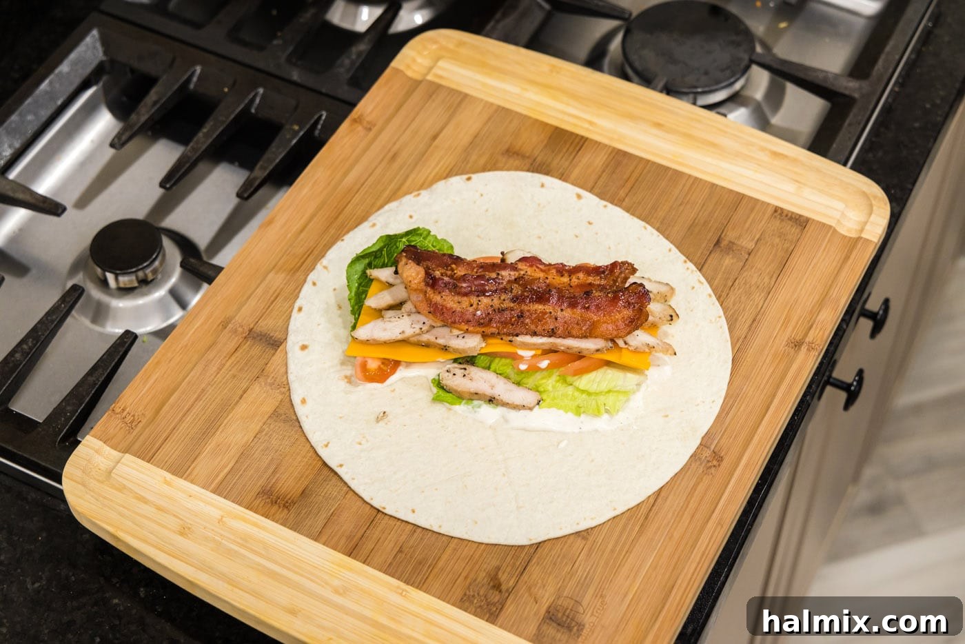 chicken bacon ranch wrap on a cutting board
