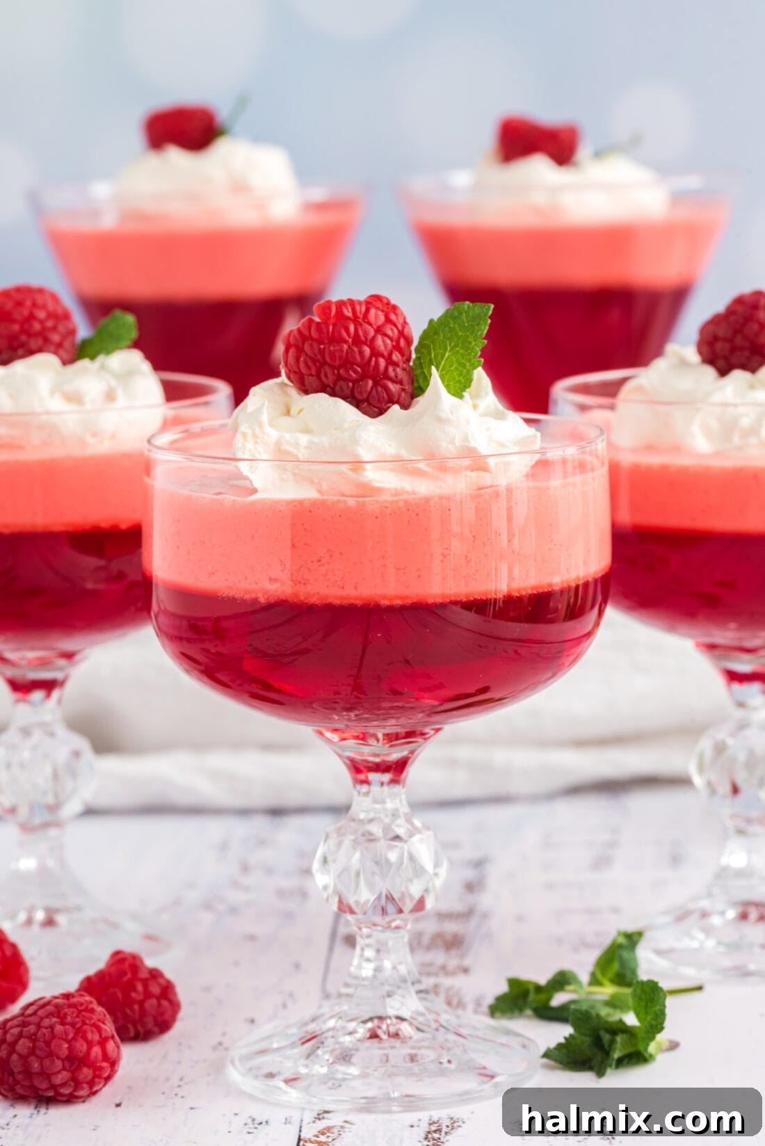 Ruby Raspberry Cream Stacks 2 Raspberry Jell-O Parfaits with whipped cream and fresh raspberries