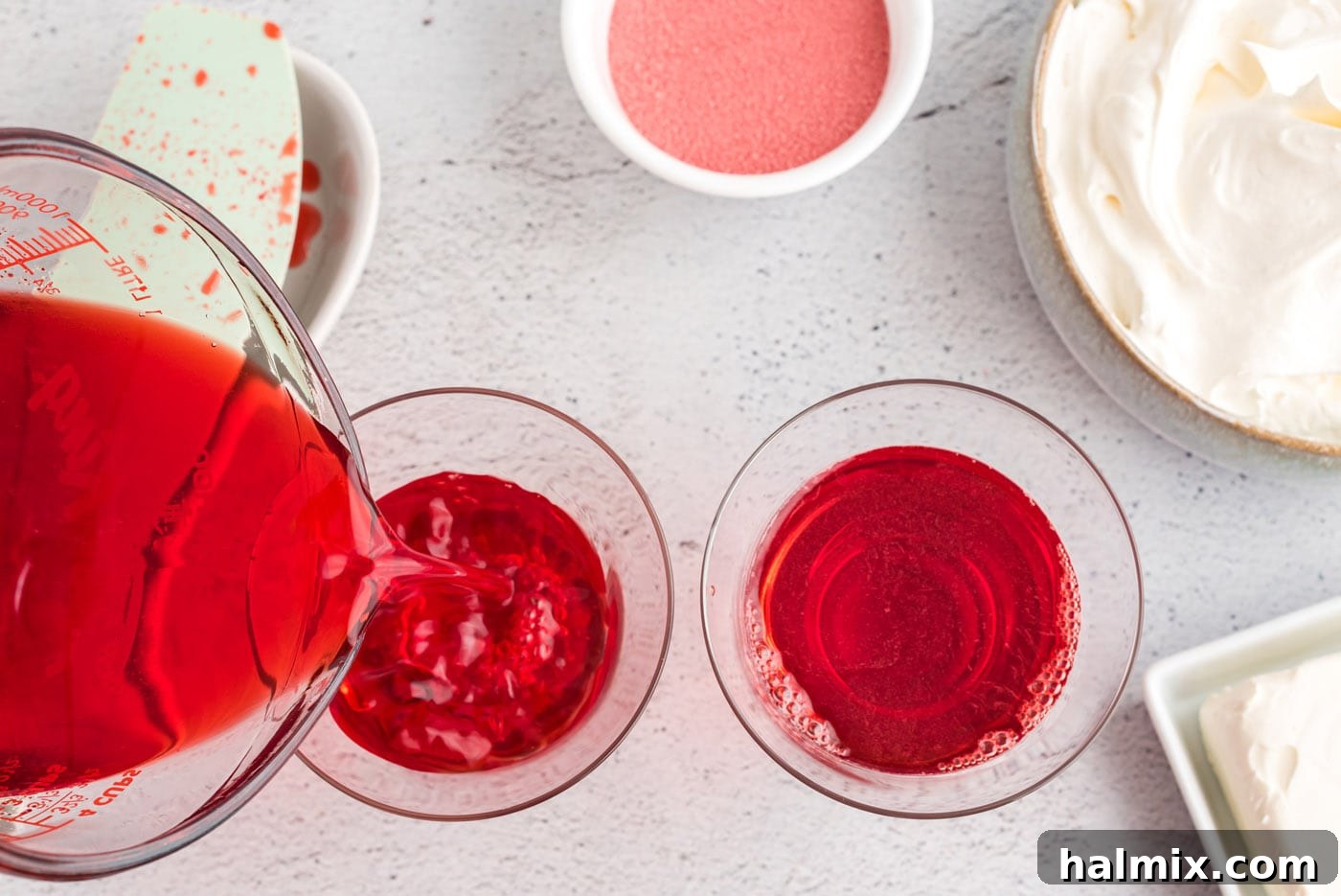 Ruby Raspberry Cream Stacks 6 pouring jello mixture into trifle dishes