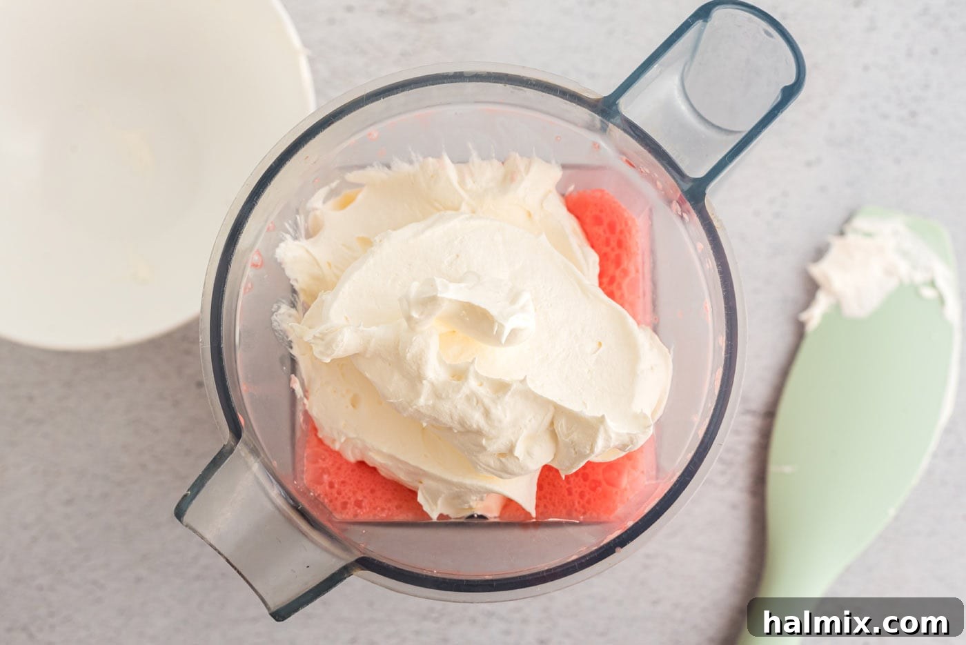 Ruby Raspberry Cream Stacks 10 cool whip on top of creamy jello mixture in a blender