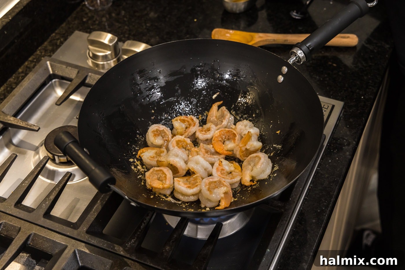 Sticky Teriyaki Shrimp 7 Shrimp being continuously stirred in the skillet, ensuring even cooking.