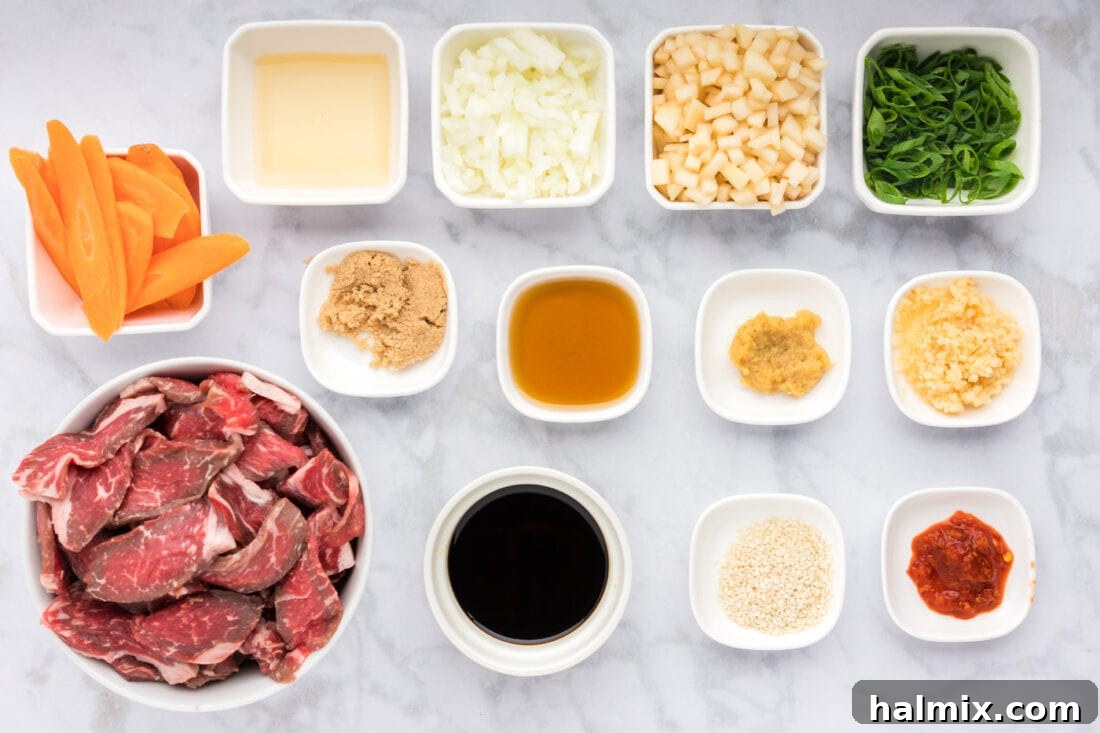 A vibrant selection of fresh ingredients laid out for Beef Bulgogi preparation, including beef, vegetables, and sauce components.