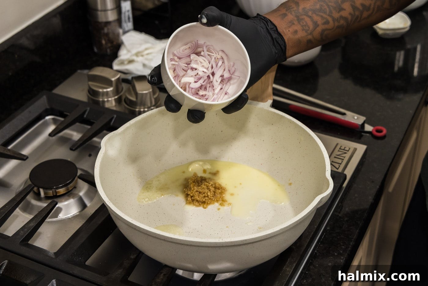 adding shallots to skillet with butter and garlic