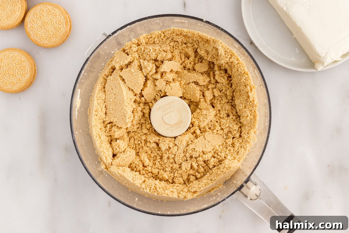 golden oreo cookie crumbs in a food processor
