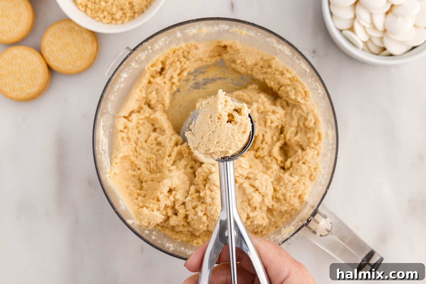 scooping dough from bowl