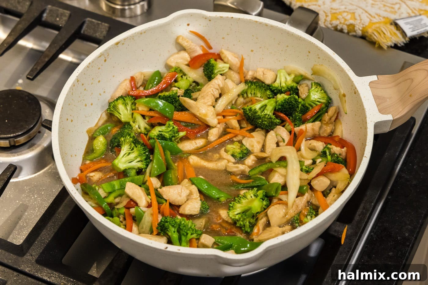 stir fried honey garlic chicken in a skillet