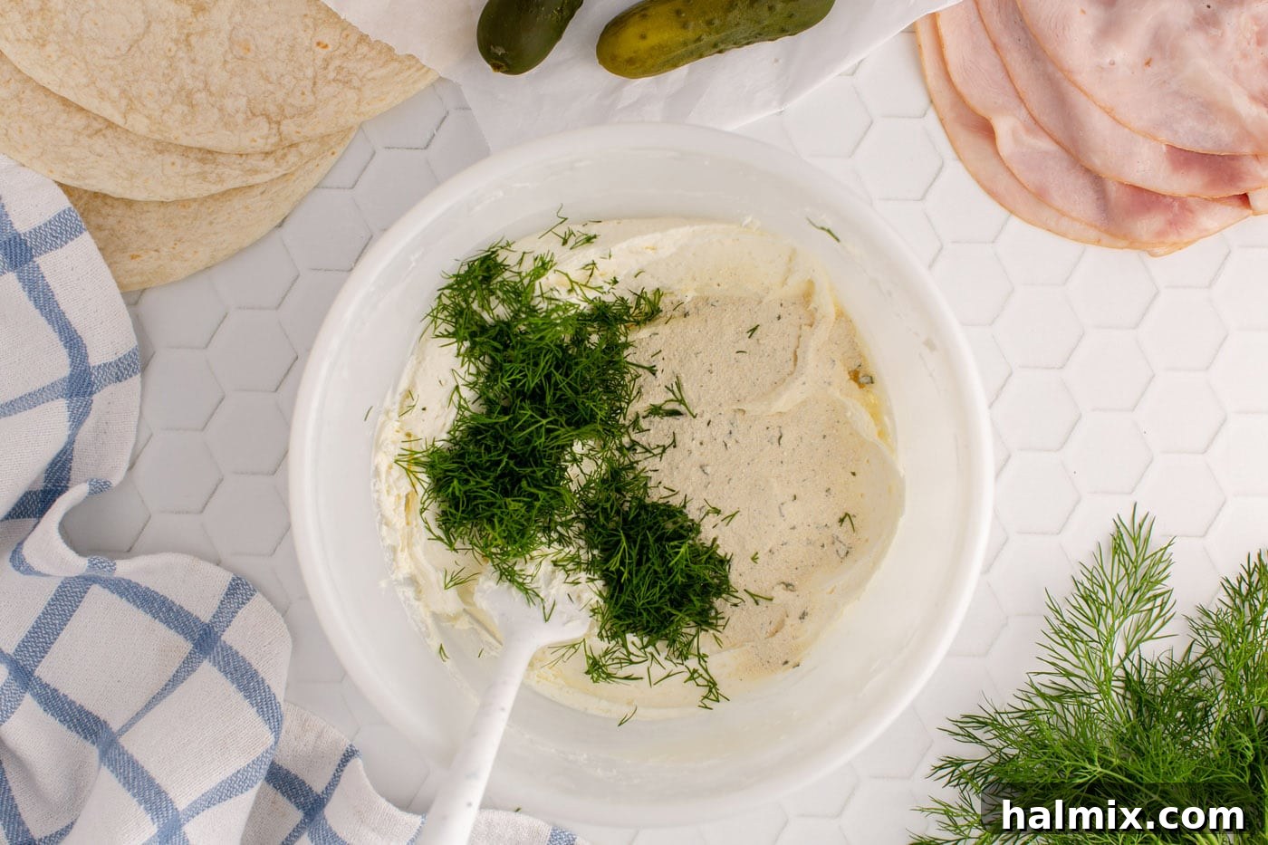 fresh dill added to cream cheese