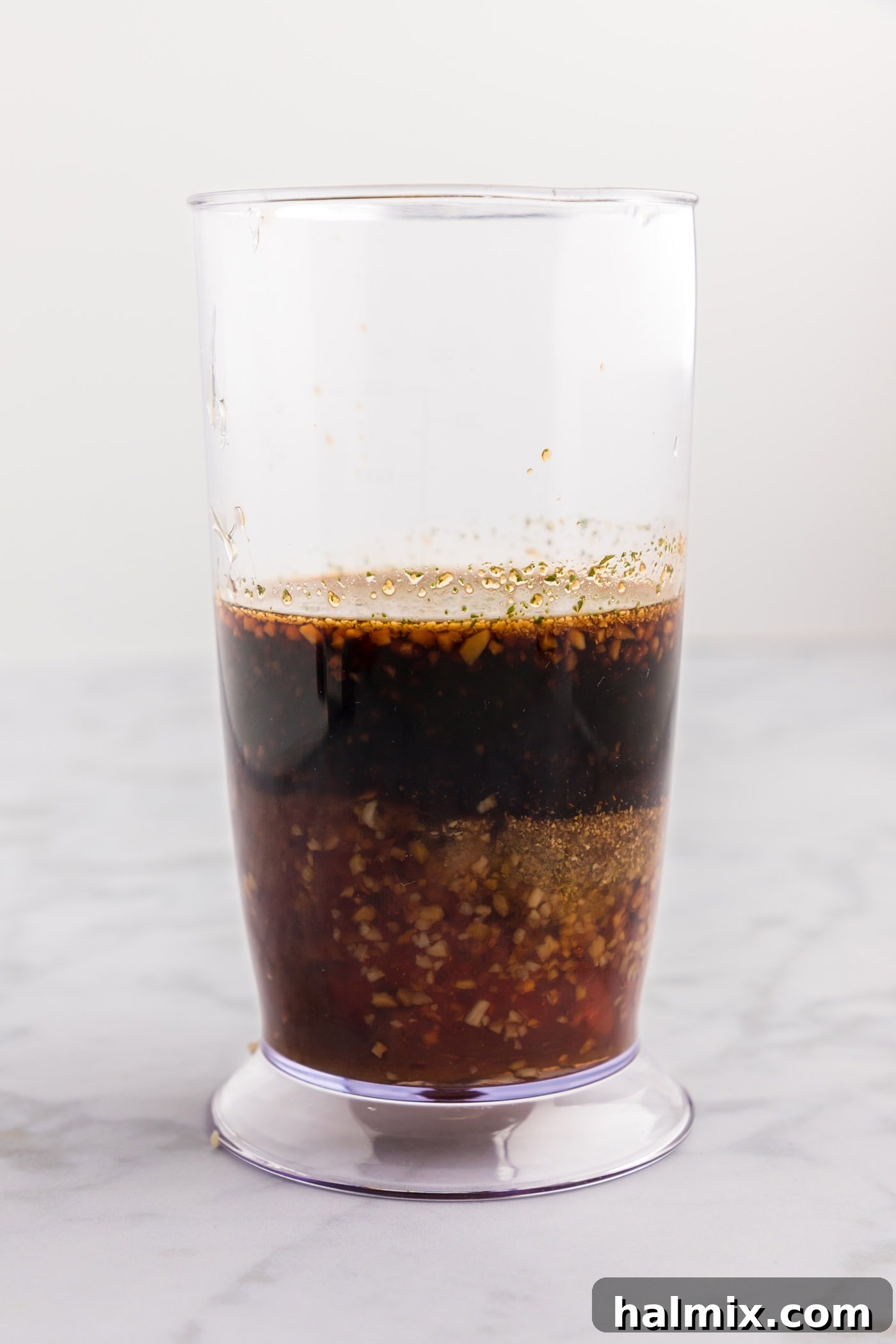 Sticky Sweet Honey Garlic Chicken Marinade 5 Soy sauce, vinegar, garlic, brown sugar, and honey in an immersion blender cup before blending