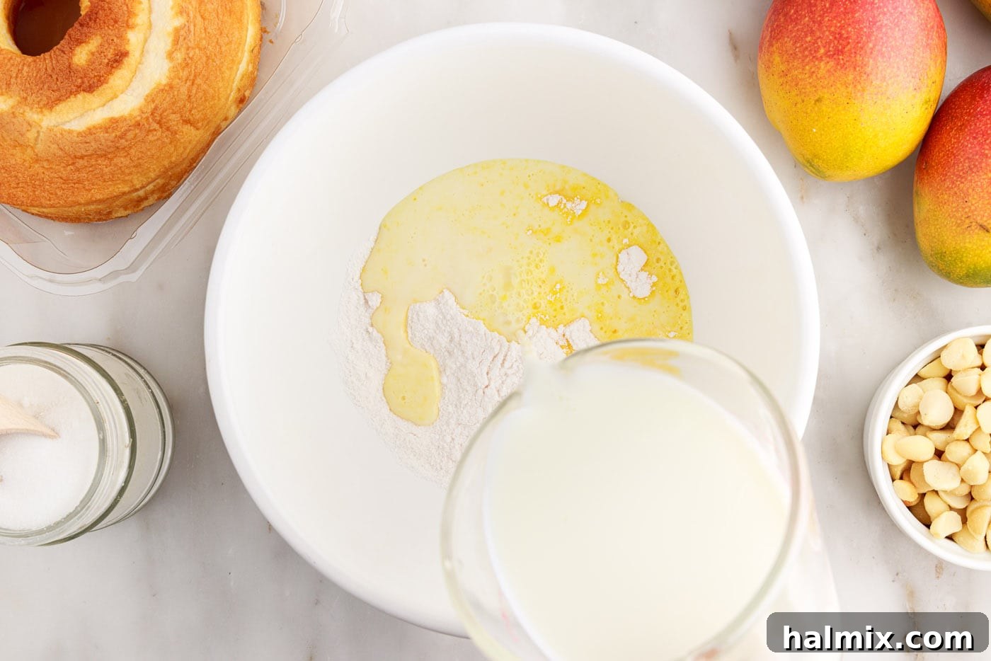 Adding milk to instant vanilla pudding mix in a bowl