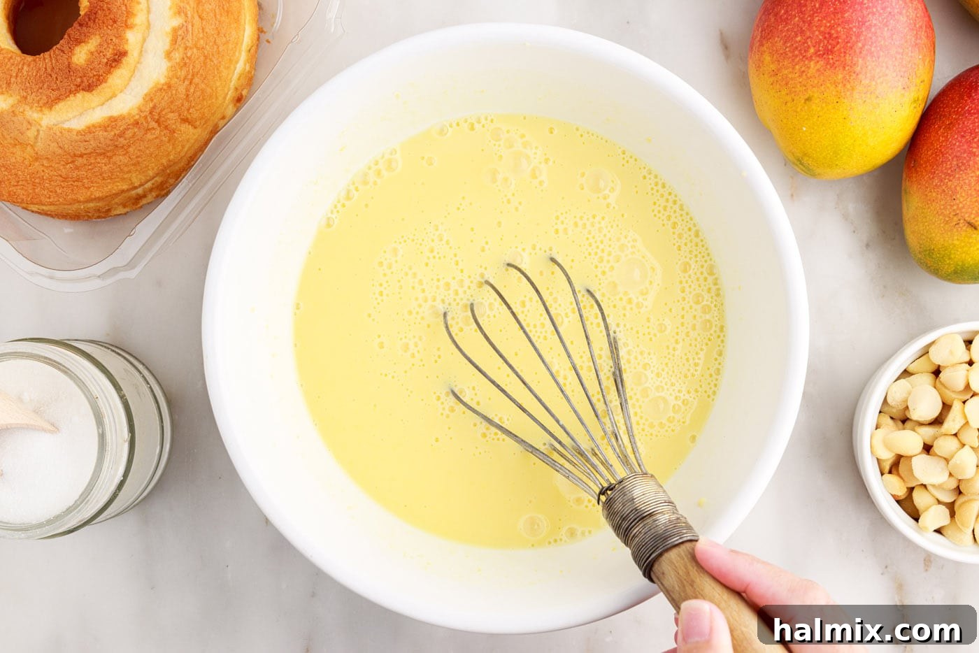 Whisking instant vanilla pudding in a bowl until smooth