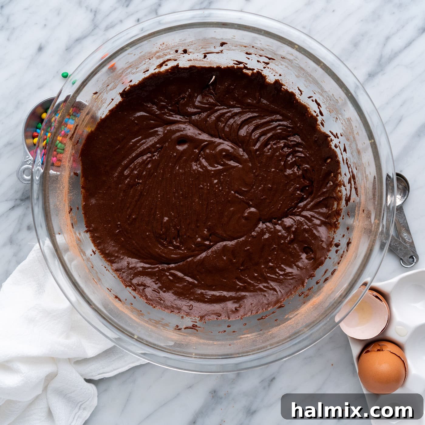 fudgy brownie batter in a mixing bowl after dry and wet ingredients are combined