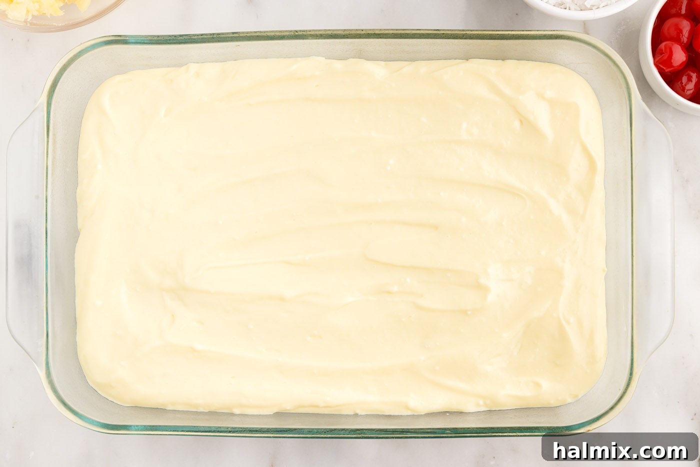 layer of cream cheese pudding spread evenly over the cooled cake base