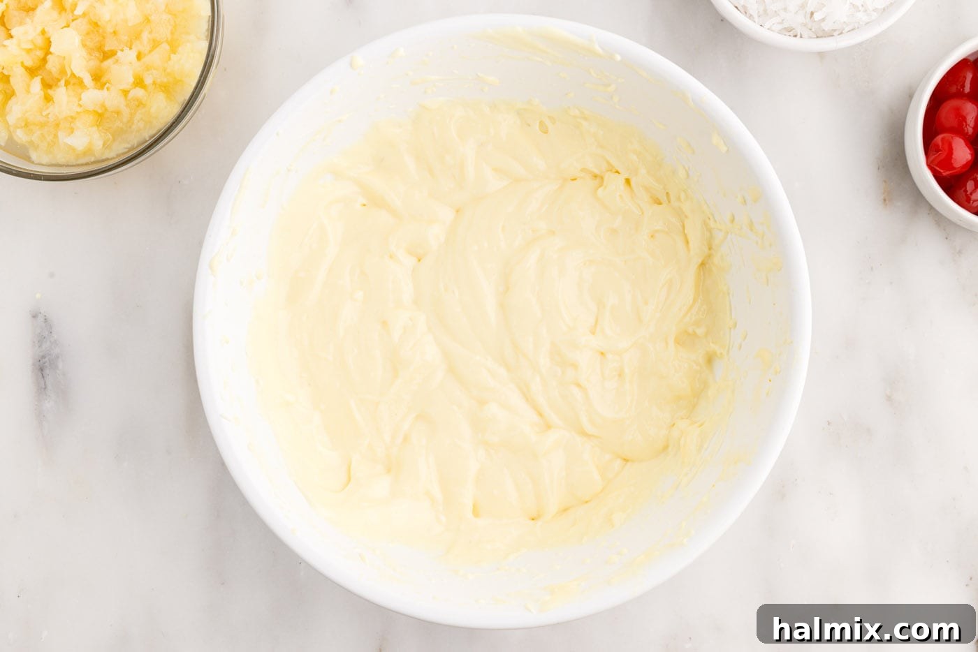 creamy cream cheese pudding mixture in a bowl, smooth and thickened