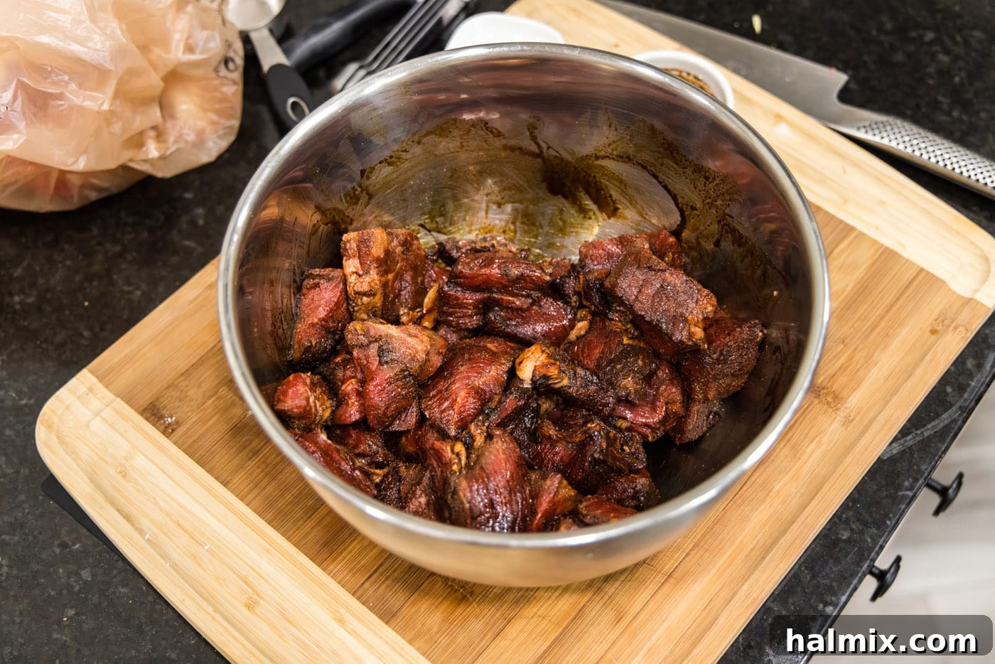 Savory Beef Bites in Velvety Gravy 6 beef tips coated in browning sauce and seasoning in a bowl