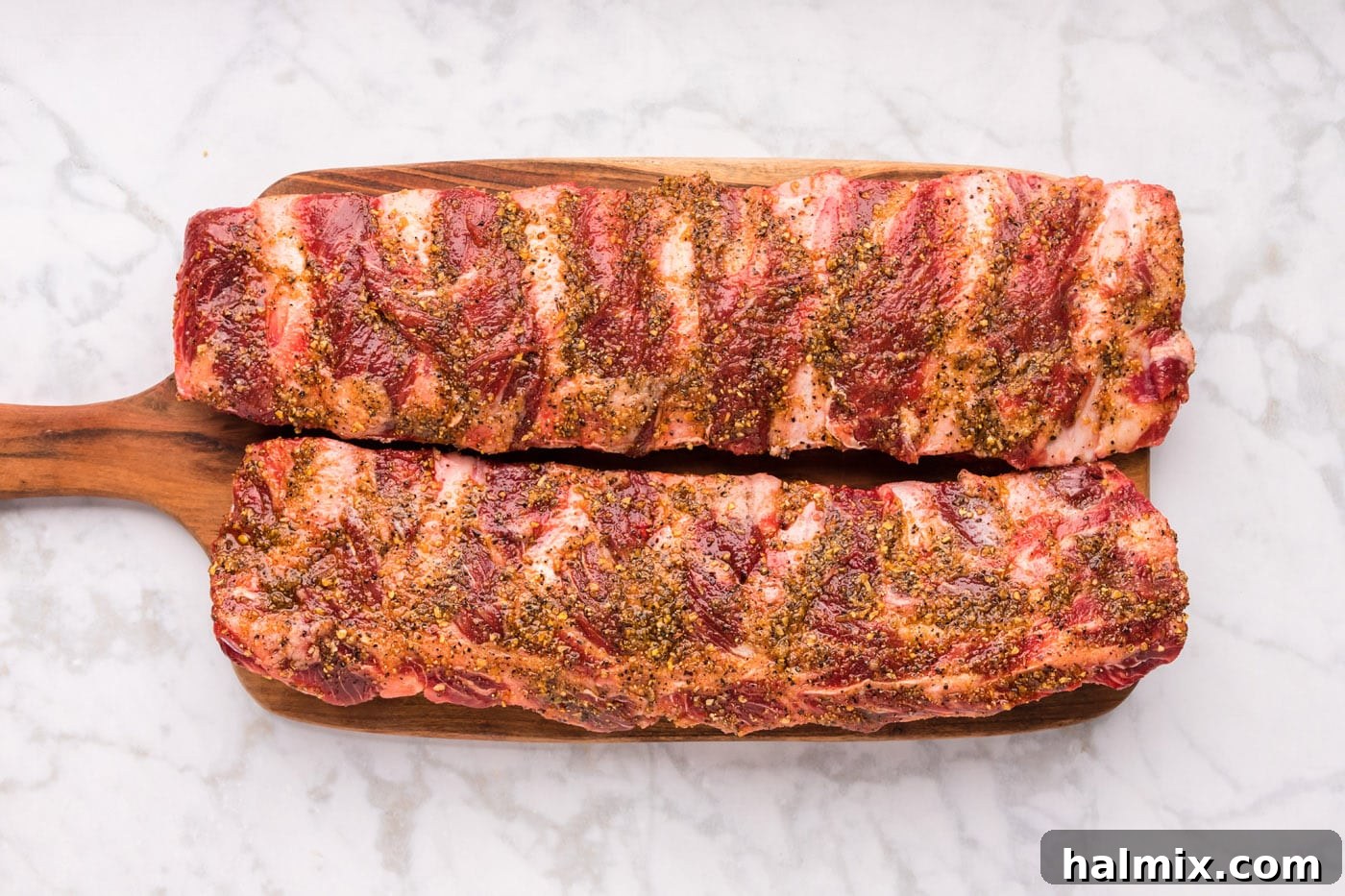 Fall-Off-The-Bone Smoked Beef Ribs 5 Beef back ribs thoroughly rubbed with olive oil and a blend of seasonings, ready for the smoker.