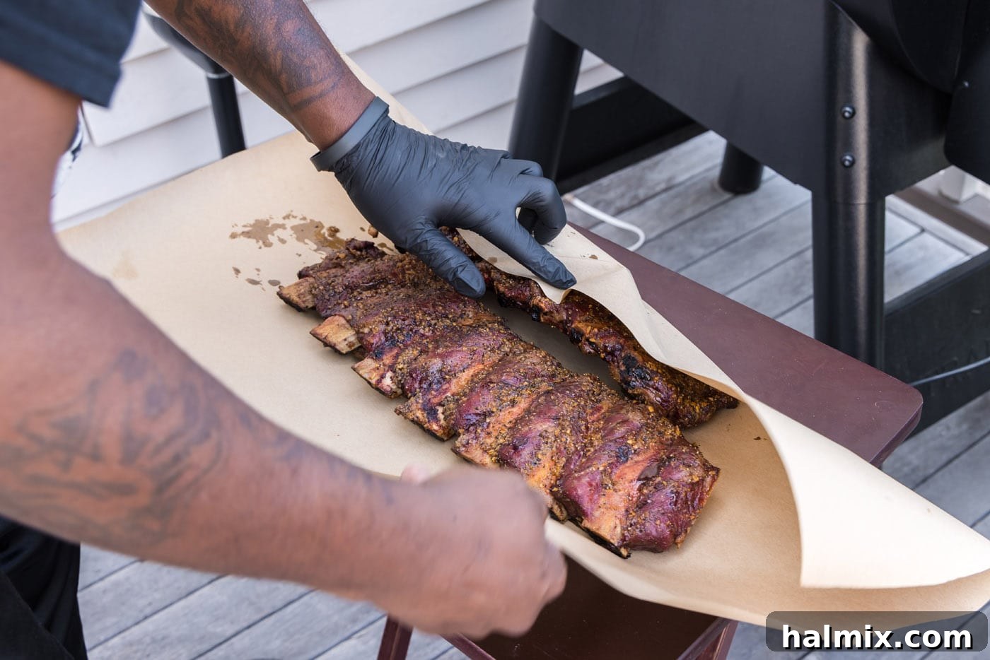 Fall-Off-The-Bone Smoked Beef Ribs 8 Wrapping smoked beef ribs in butcher paper, a key step for tenderizing and resting the meat.