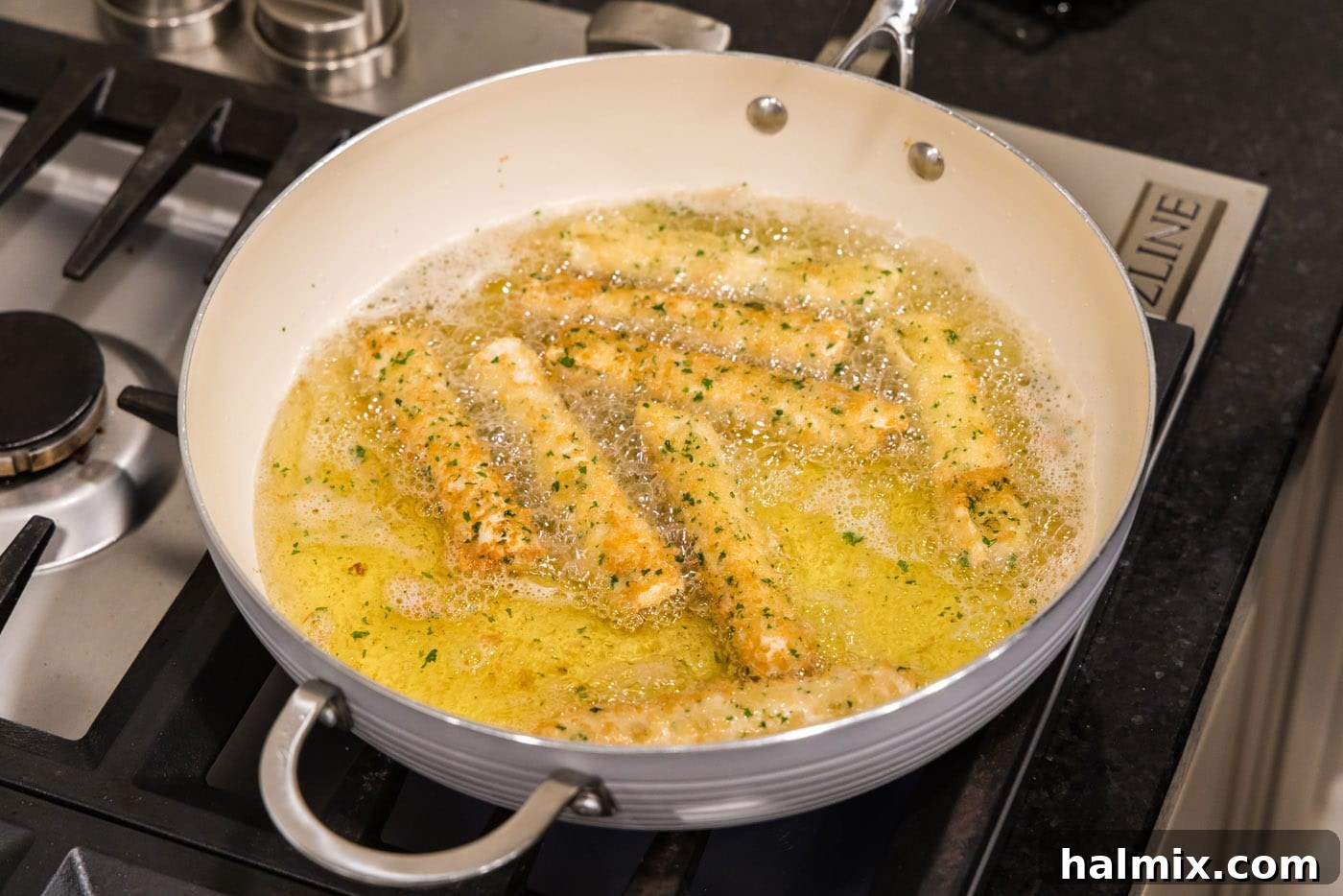 Crispy Wonton Cheese Bites 15 deep fried wonton cheese sticks in a skillet