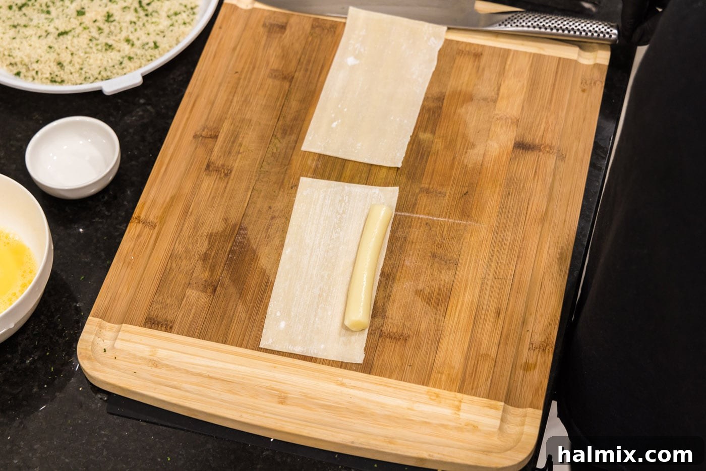 Crispy Wonton Cheese Bites 8 string cheese stick on top of egg roll wrapper
